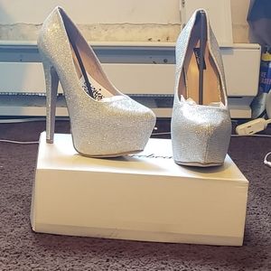Stilettos, heels. Size 6.5. Silver